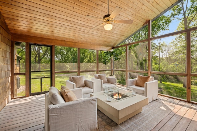 605 Stubbs Bay Rd, Orono, MN 55356 - sunroom featuring vaulted ceiling, an outdoor living space with a fire pit, ceiling fan, and plenty of natural light