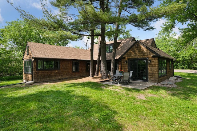 605 Stubbs Bay Rd, Orono, MN 55356 - rear view of property with a chimney, a shingled roof, a lawn, and a patio area