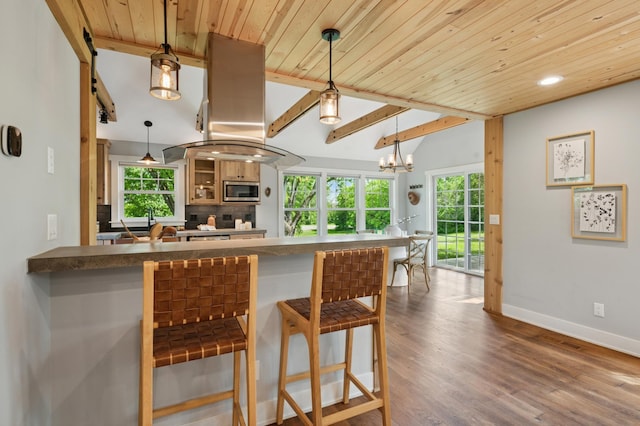 605 Stubbs Bay Rd, Orono, MN 55356 - kitchen with stainless steel microwave, wood ceiling with exposed beams, dark countertops, a breakfast bar area, and dark wood-style flooring