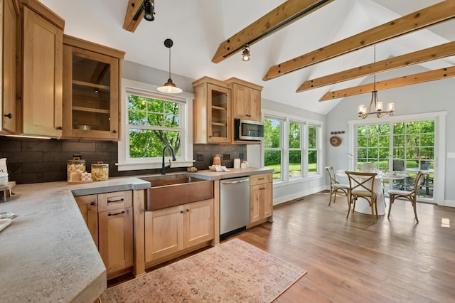 605 Stubbs Bay Rd, Orono, MN 55356 - kitchen with stainless steel appliances, a sink, tasteful backsplash, and plenty of natural light