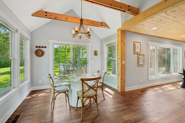 605 Stubbs Bay Rd, Orono, MN 55356 - dining room with a chandelier, dark wood-style flooring, and baseboards