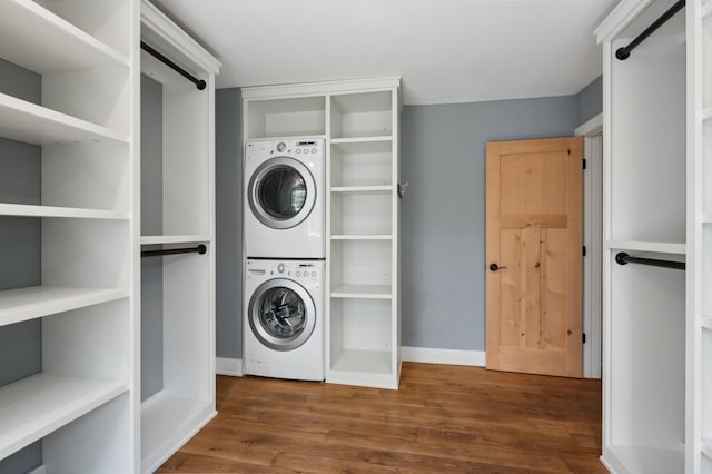 605 Stubbs Bay Rd, Orono, MN 55356 - laundry room with estacked washer and dryer, wood finished floors, and baseboards