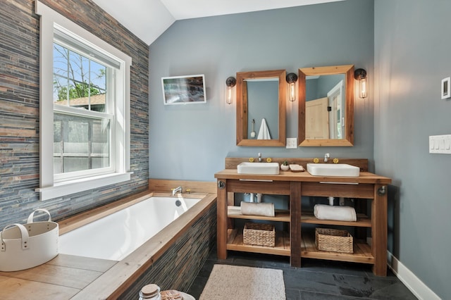 605 Stubbs Bay Rd, Orono, MN 55356 - full bath featuring lofted ceiling, a bath, double vanity, and baseboards
