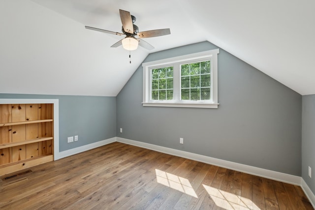 605 Stubbs Bay Rd, Orono, MN 55356 - bonus room featuring hardwood / wood-style flooring, baseboards, a ceiling fan, and lofted ceiling