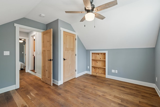 605 Stubbs Bay Rd, Orono, MN 55356 - additional living space featuring ceiling fan, lofted ceiling, wood-type flooring, and baseboards