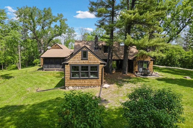 605 Stubbs Bay Rd, Orono, MN 55356 - back of house with a lawn, a chimney, and a shingled roof