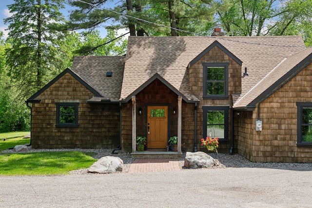 605 Stubbs Bay Rd, Orono, MN 55356 - view of front of home with a shingled roof and a chimney