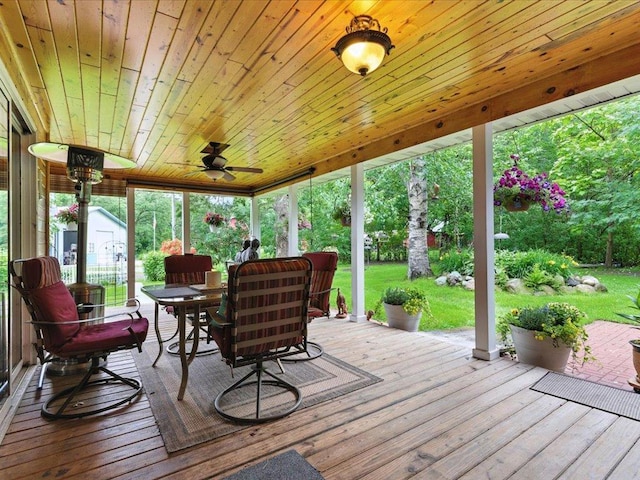 32166 Azure Rd, Scandia Valley Twp, MN 56443 - wooden deck featuring a ceiling fan, a lawn, and outdoor dining area
