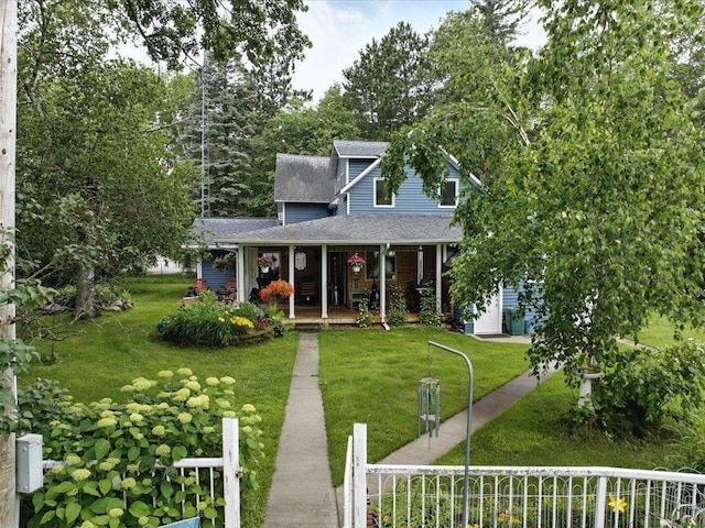 32166 Azure Rd, Scandia Valley Twp, MN 56443 - view of front of property featuring a porch, roof with shingles, and a front yard