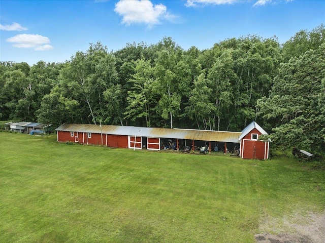32166 Azure Rd, Scandia Valley Twp, MN 56443 - ranch-style home with a front yard, a wooded view, and a storage shed