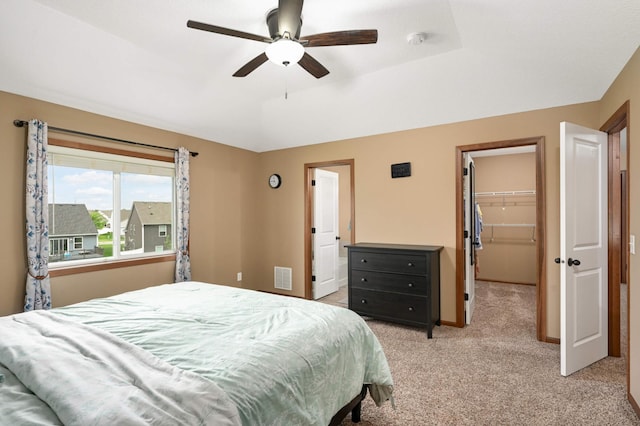 15239 Embry Path, Apple Valley, MN 55124 - bedroom featuring light colored carpet, a walk in closet, a closet, and ceiling fan