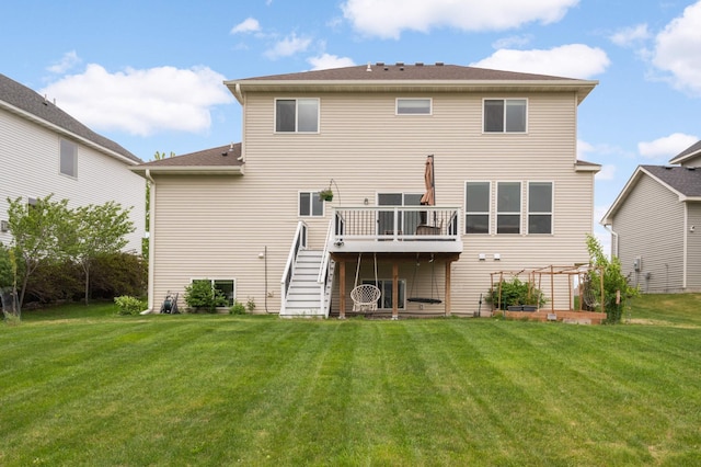 15239 Embry Path, Apple Valley, MN 55124 - rear view of house featuring a deck, stairs, and a lawn