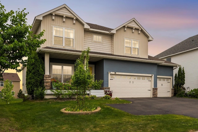 15239 Embry Path, Apple Valley, MN 55124 - craftsman-style house featuring board and batten siding, asphalt driveway, an attached garage, stone siding, and a front yard