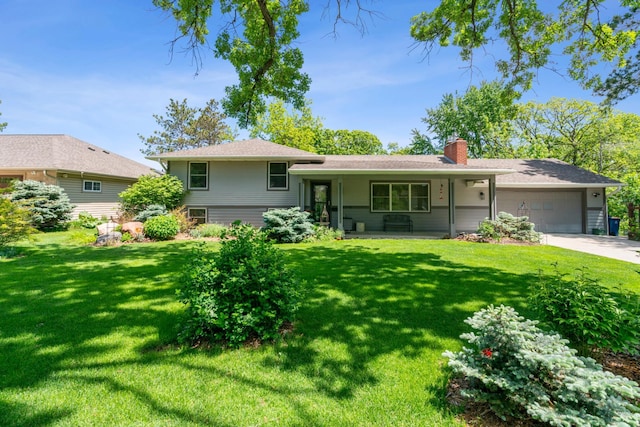 4716 Overlook Dr, Bloomington, MN 55437 - view of front of home featuring a chimney, a front lawn, an attached garage, concrete driveway, and covered porch
