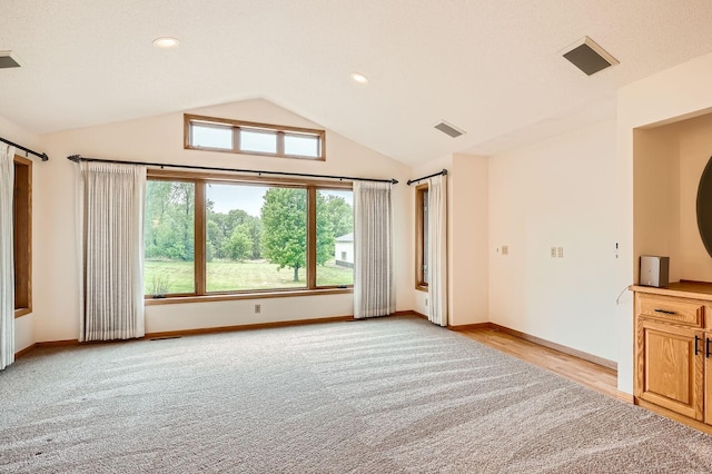 3544 166th Ln NW, Andover, MN 55304 - spare room featuring lofted ceiling, baseboards, light colored carpet, and recessed lighting