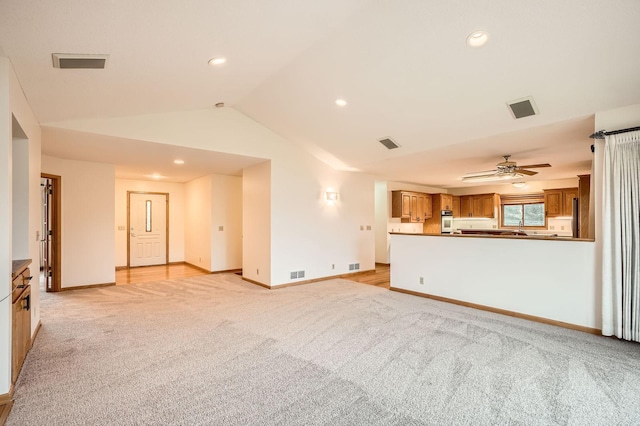 3544 166th Ln NW, Andover, MN 55304 - unfurnished living room featuring light colored carpet, vaulted ceiling, baseboards, a ceiling fan, and recessed lighting