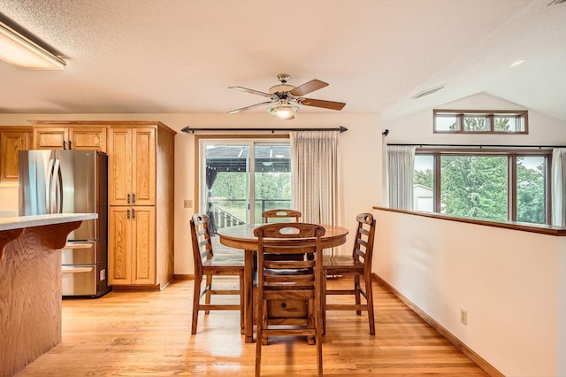 3544 166th Ln NW, Andover, MN 55304 - dining room featuring ceiling fan, light wood-style flooring, baseboards, and vaulted ceiling