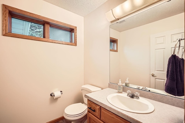3544 166th Ln NW, Andover, MN 55304 - half bath featuring toilet, a textured ceiling, and vanity