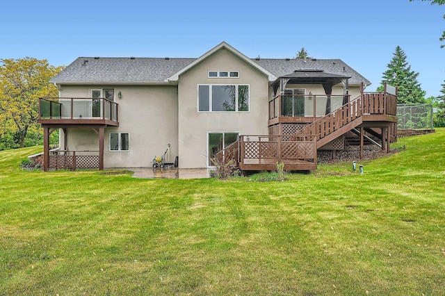 3544 166th Ln NW, Andover, MN 55304 - rear view of property with stucco siding, a lawn, a deck, a patio area, and a shingled roof