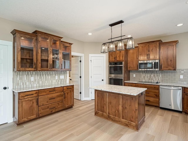 20713 Tamarack St NW, Oak Grove, MN 55011 - kitchen with stainless steel appliances, light wood-style floors, backsplash, light stone countertops, and recessed lighting