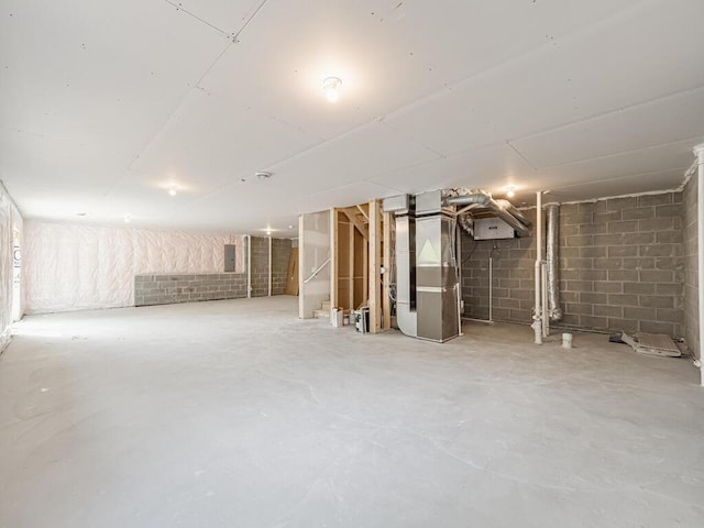 20713 Tamarack St NW, Oak Grove, MN 55011 - unfinished below grade area featuring heating unit, concrete block wall, and electric panel