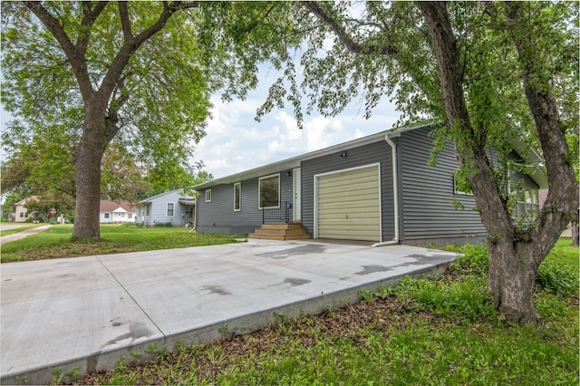 619 Aspen Ave S, Amery, WI 54001 - view of front of property with a garage, driveway, and a front lawn
