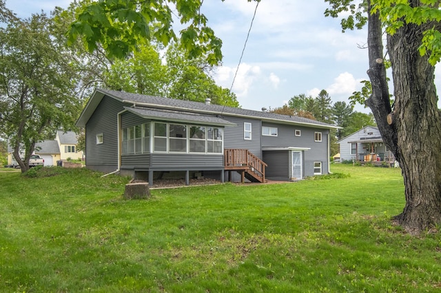 619 Aspen Ave S, Amery, WI 54001 - rear view of property with a sunroom, a lawn, and stairs