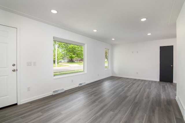 619 Aspen Ave S, Amery, WI 54001 - unfurnished room with dark wood-type flooring, recessed lighting, and baseboards