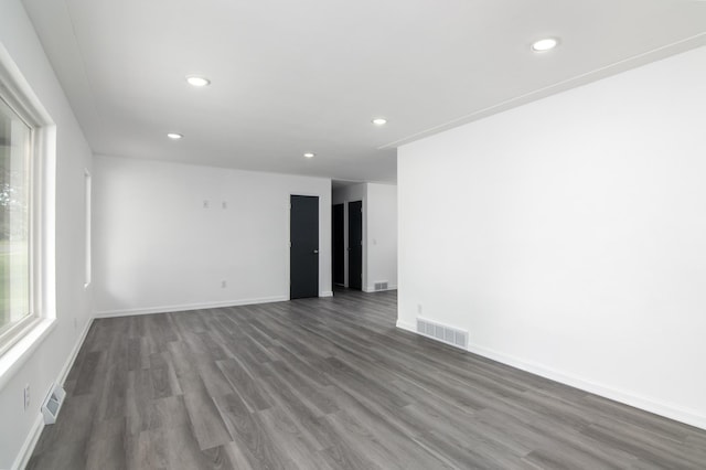 619 Aspen Ave S, Amery, WI 54001 - spare room with wood finished floors, recessed lighting, and baseboards