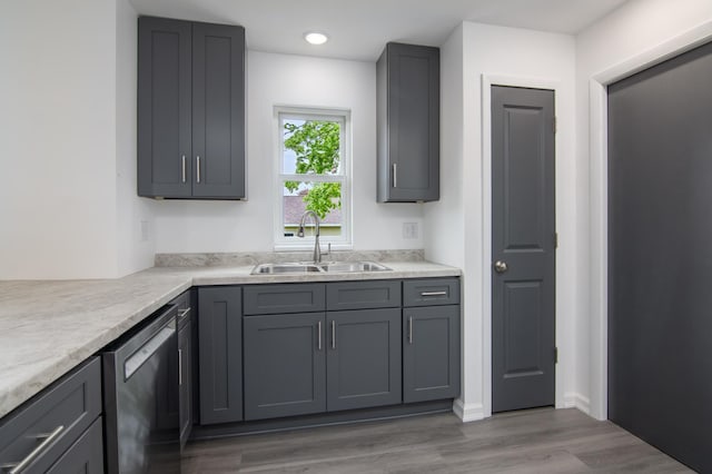 619 Aspen Ave S, Amery, WI 54001 - kitchen featuring a sink, stainless steel dishwasher, gray cabinets, wood finished floors, and recessed lighting