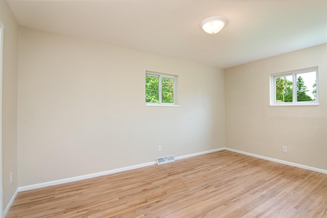619 Aspen Ave S, Amery, WI 54001 - unfurnished room featuring light wood-type flooring and baseboards