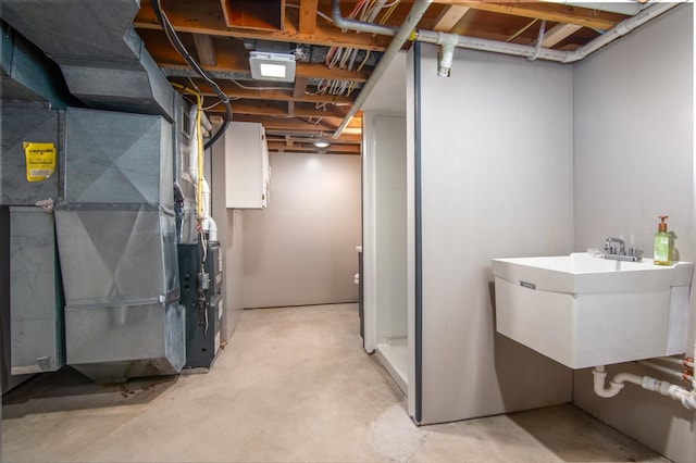 619 Aspen Ave S, Amery, WI 54001 - unfinished basement with a sink and heating unit