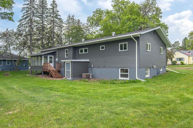 619 Aspen Ave S, Amery, WI 54001 - rear view of property with a sunroom, a lawn, and stairway