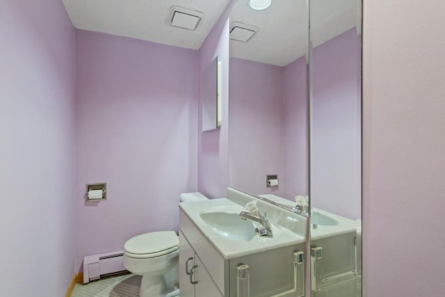 364 Owasso Blvd N, Shoreview, MN 55126 - bathroom featuring a baseboard radiator, vanity, toilet, baseboards, and tile patterned floors