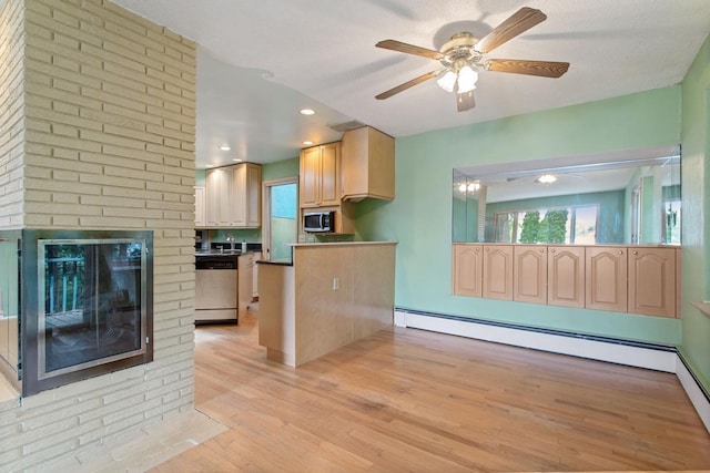 364 Owasso Blvd N, Shoreview, MN 55126 - kitchen with stainless steel appliances, light wood-style flooring, a ceiling fan, a peninsula, and a brick fireplace