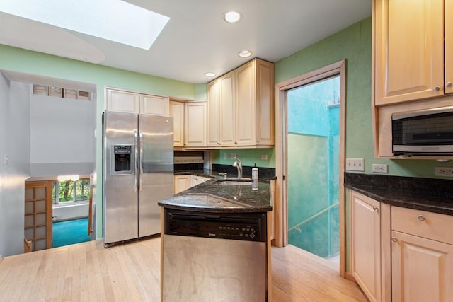 364 Owasso Blvd N, Shoreview, MN 55126 - kitchen featuring appliances with stainless steel finishes, a sink, light wood finished floors, dark stone countertops, and recessed lighting