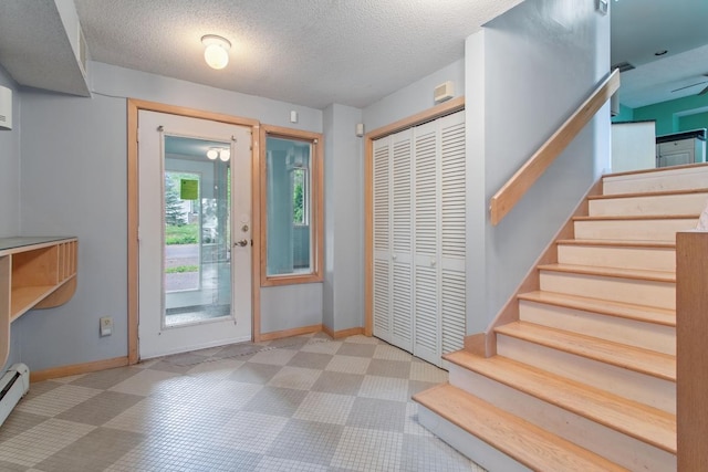 364 Owasso Blvd N, Shoreview, MN 55126 - foyer entrance featuring stairway, baseboards, baseboard heating, a textured ceiling, and tile patterned floors
