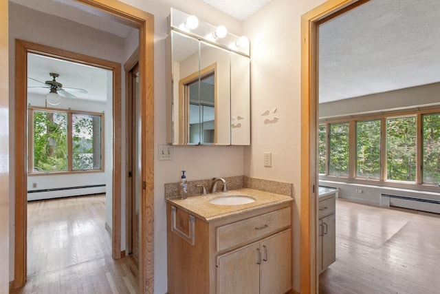 364 Owasso Blvd N, Shoreview, MN 55126 - bathroom with baseboard heating, healthy amount of natural light, and vanity