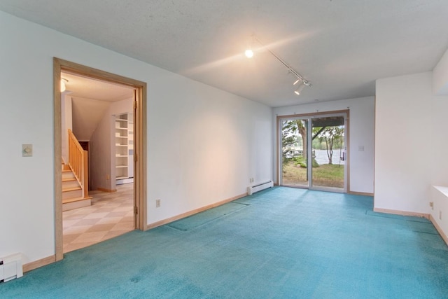 364 Owasso Blvd N, Shoreview, MN 55126 - carpeted empty room with rail lighting, a baseboard heating unit, and baseboards