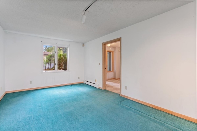 364 Owasso Blvd N, Shoreview, MN 55126 - spare room with a baseboard heating unit, carpet floors, baseboards, and a textured ceiling