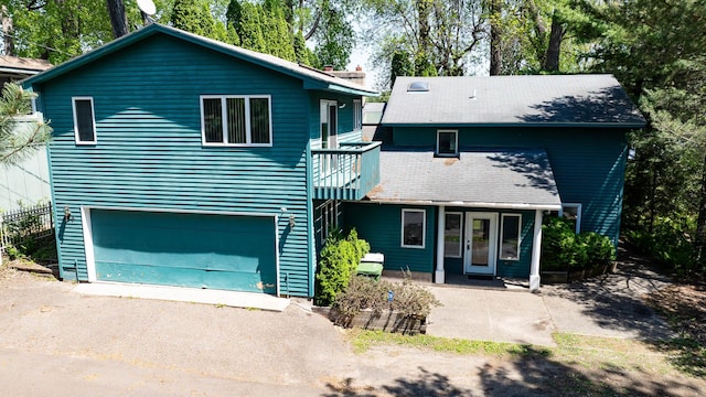364 Owasso Blvd N, Shoreview, MN 55126 - view of front of property with an attached garage, french doors, and driveway