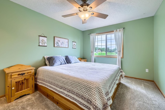 12729 Eagle St NW, Coon Rapids, MN 55448 - bedroom featuring light colored carpet, baseboards, a ceiling fan, and a textured ceiling