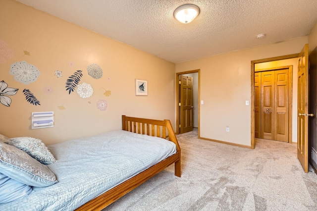 12729 Eagle St NW, Coon Rapids, MN 55448 - bedroom with light carpet, a textured ceiling, and baseboards