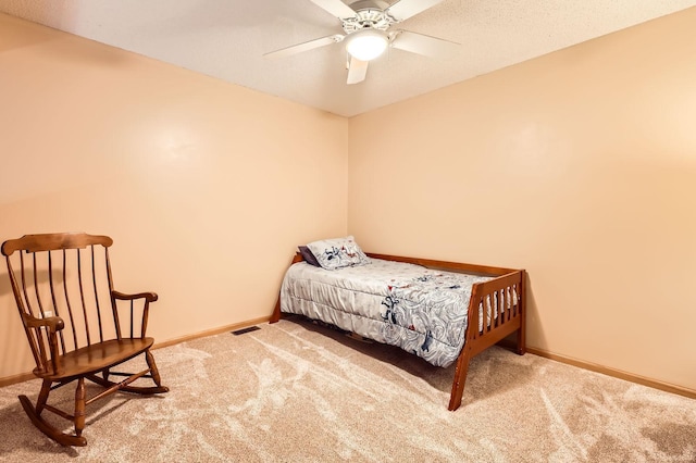 12729 Eagle St NW, Coon Rapids, MN 55448 - carpeted bedroom with baseboards and ceiling fan