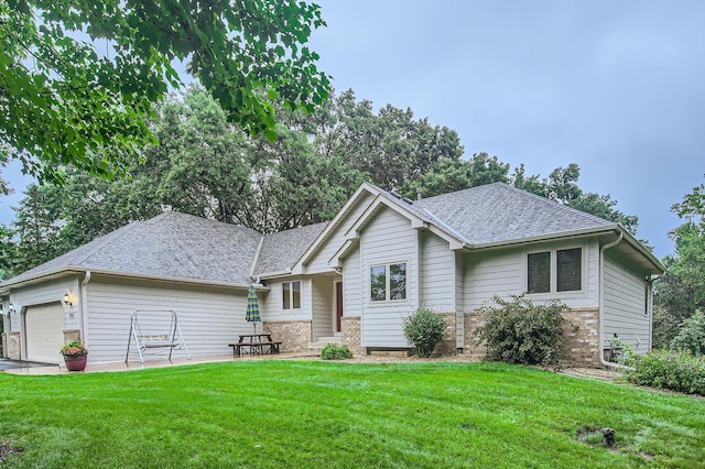 701 Parkview Ln N, Champlin, MN 55316 - view of front of property featuring brick siding, a front yard, a garage, and a shingled roof