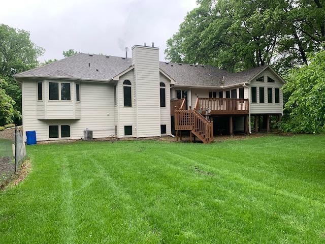 701 Parkview Ln N, Champlin, MN 55316 - back of property featuring stairway, a deck, a chimney, a yard, and cooling unit