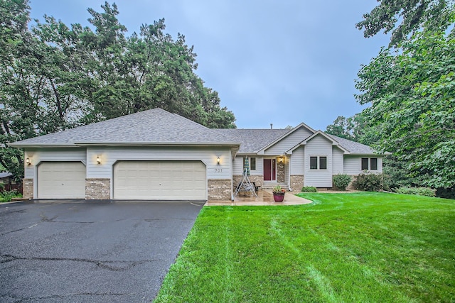 701 Parkview Ln N, Champlin, MN 55316 - single story home featuring an attached garage, driveway, a front lawn, roof with shingles, and brick siding
