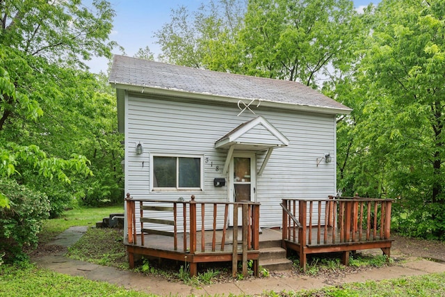 318 Austin Ave, Litchfield, MN 55355 - rear view of house with a wooden deck