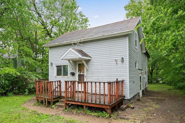 318 Austin Ave, Litchfield, MN 55355 - rear view of property featuring a deck and a shingled roof
