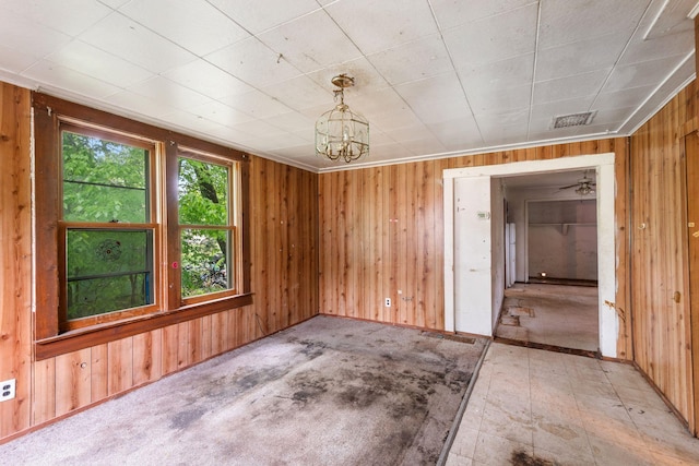 318 Austin Ave, Litchfield, MN 55355 - unfurnished dining area featuring wooden walls and a chandelier